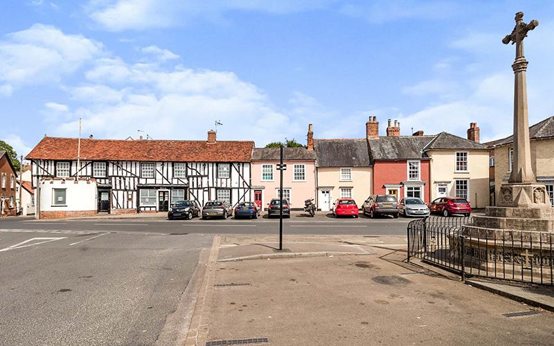 tudor haverhill home amongst modern street